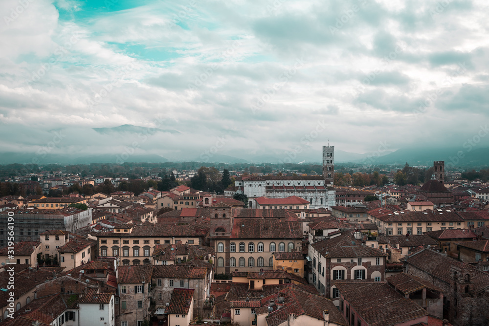 Skyline high up view of the quiet Tuscantown of Lucca, Italy