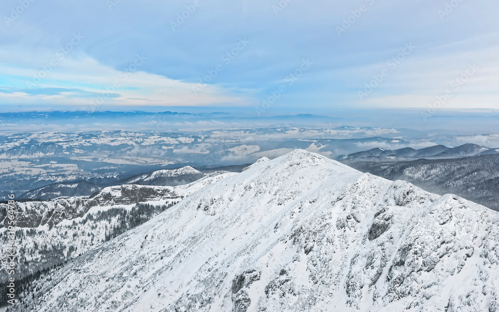 Panoramic view from Kasprowy Wierch in Zakopane in Tatra Mounts in winter. Zakopane is a town in Poland in Tatras. Kasprowy Wierch is a mount in Zakopane and the most popular ski area in Poland