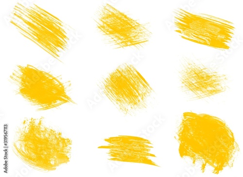 Yellow paint smears isolated on white background. Set of yellow paint strokes