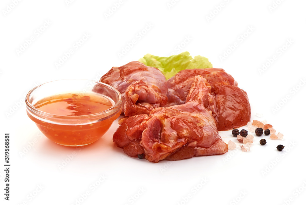 Raw chicken legs in a barbecue marinade, isolated on white background Raw chicken legs in a barbecue marinade, isolated on white background