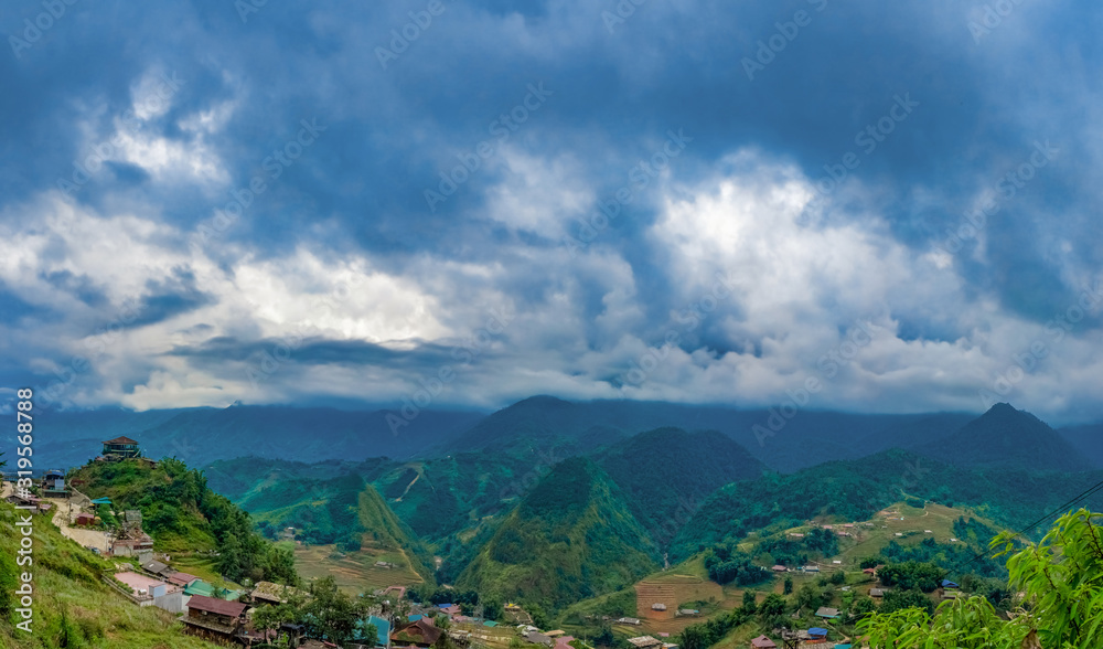 Big panorama. scenery of Cat Cat village, popular tourist trekking destination. Rice field terraces.  Mountain view in the clouds. Sapa, Lao Cai Province, north-west Vietnam.