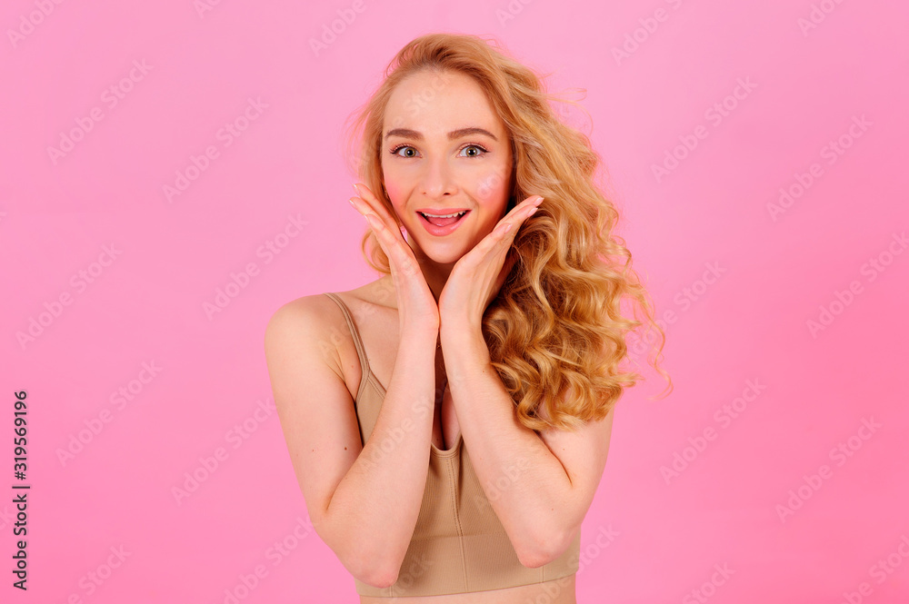 Gorgeous young blonde posing on a bright background Gorgeous young blonde posing on a bright background