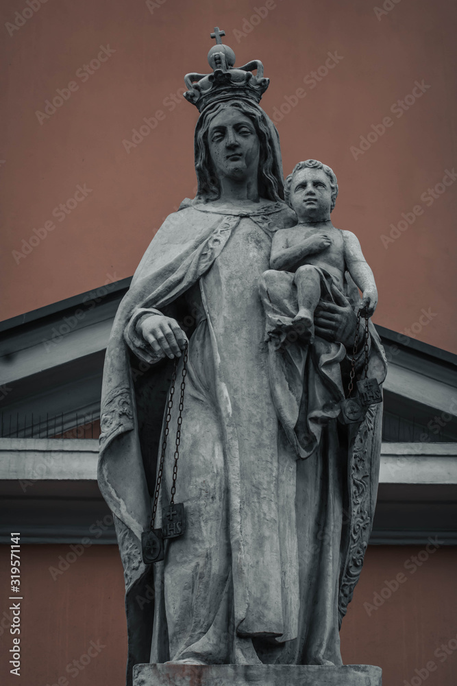 statue of a woman with a child in Warsaw