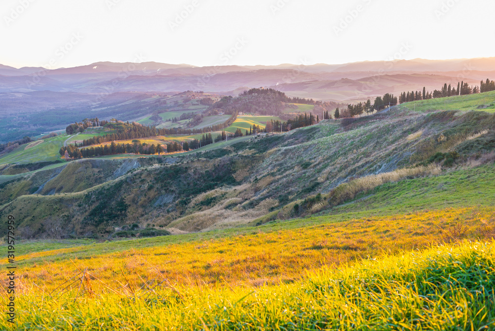 Tuscany hills countryside Italian landscape colorful at sunset. Italy