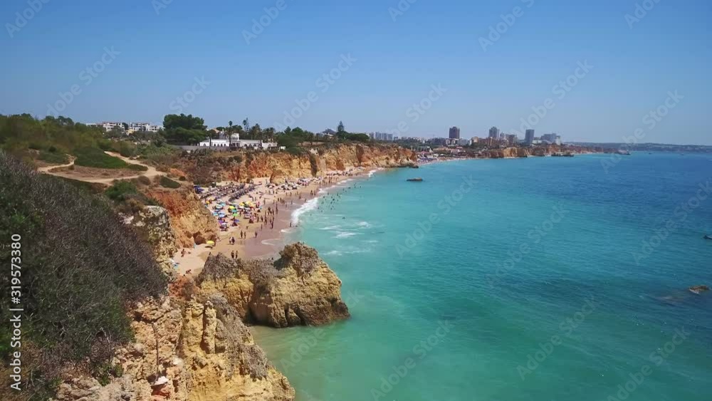 Aerial view of the beach Alemao, Vao, Amado Portuguese Algarve coast and tourists relax on vacation. Aerial view of the beach Alemao, Vao, Amado Portuguese Algarve coast and tourists relax on vacation.