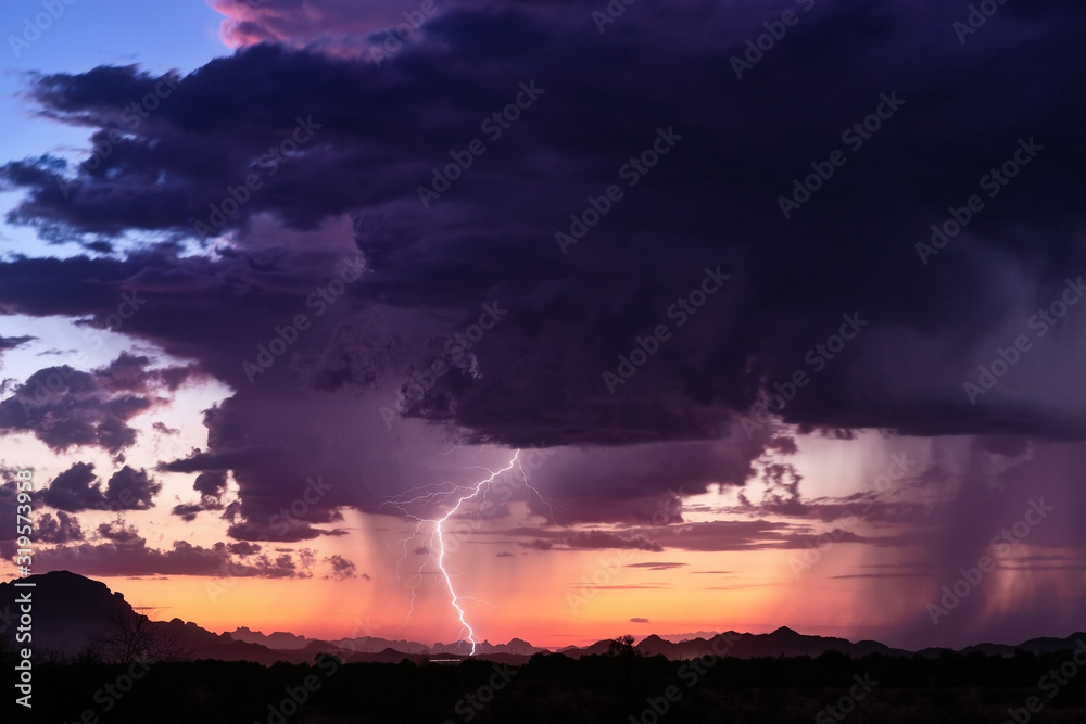 Dramatic sunset sky with desert lightning and storm clouds in Arizona