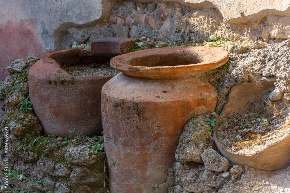 Italy, Pompeii, archaeological area, remains of the city buried by the eruption of ashes and rocks of Vesuvius in 79. Details of a grocery store Italy, Pompeii, archaeological area, remains of the city buried by the eruption of ashes and rocks of Vesuvius in 79. Details of a grocery store