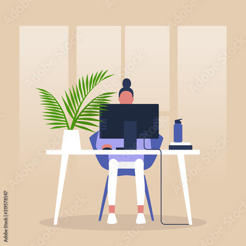 Modern office, Young female manager sitting in front of the monitor, Millennials at work, Business process