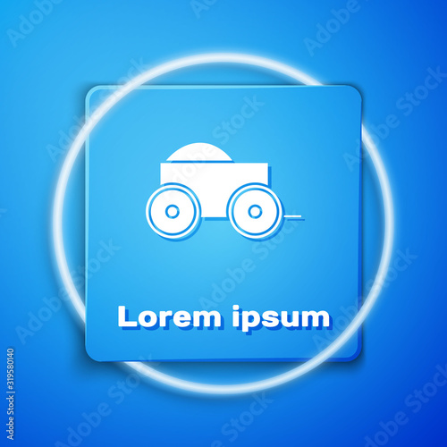 White Wooden four-wheel cart with hay icon isolated on blue background. Blue square button. Vector Illustration