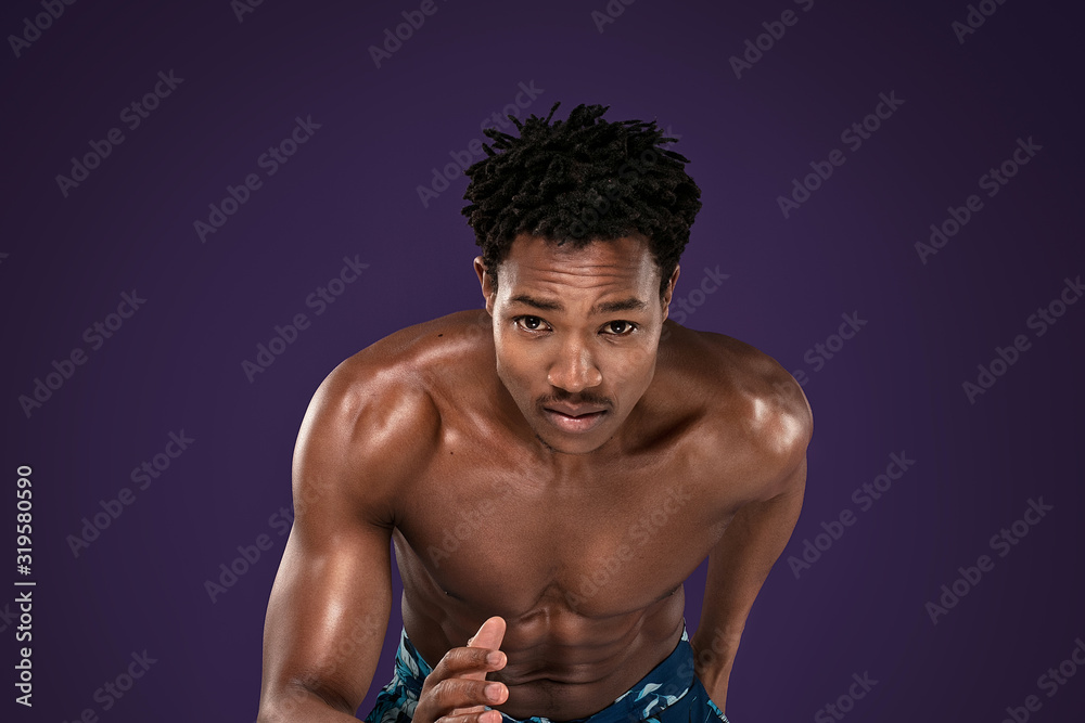 Fototapeta premium African man running in studio.