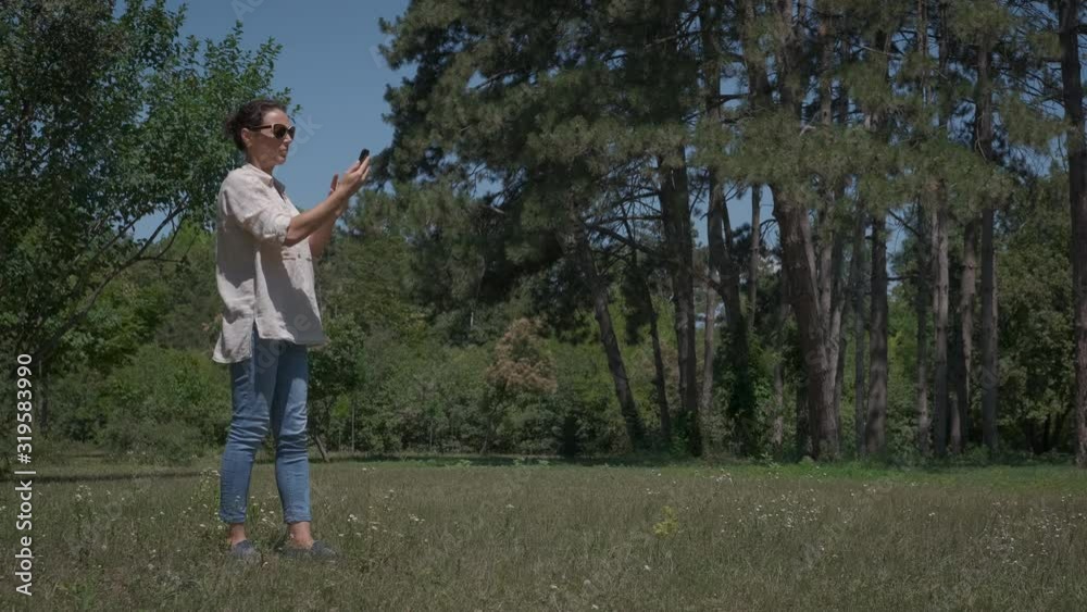 No phone signal. A woman in nature is trying to catch a smartphone signal. No phone signal. A woman in nature is trying to catch a smartphone signal.
