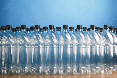 empty plastic bottles on blue background