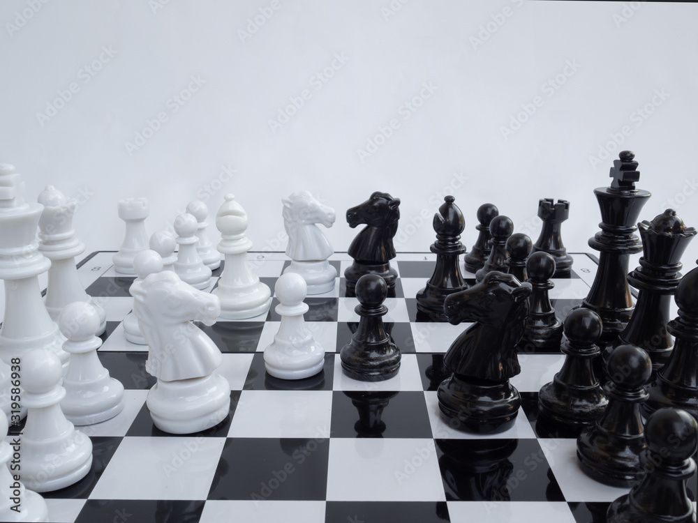 Chess game to demonstrate business strategy in world market.  competition in business.