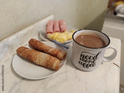 cup of coffee and cookies on table