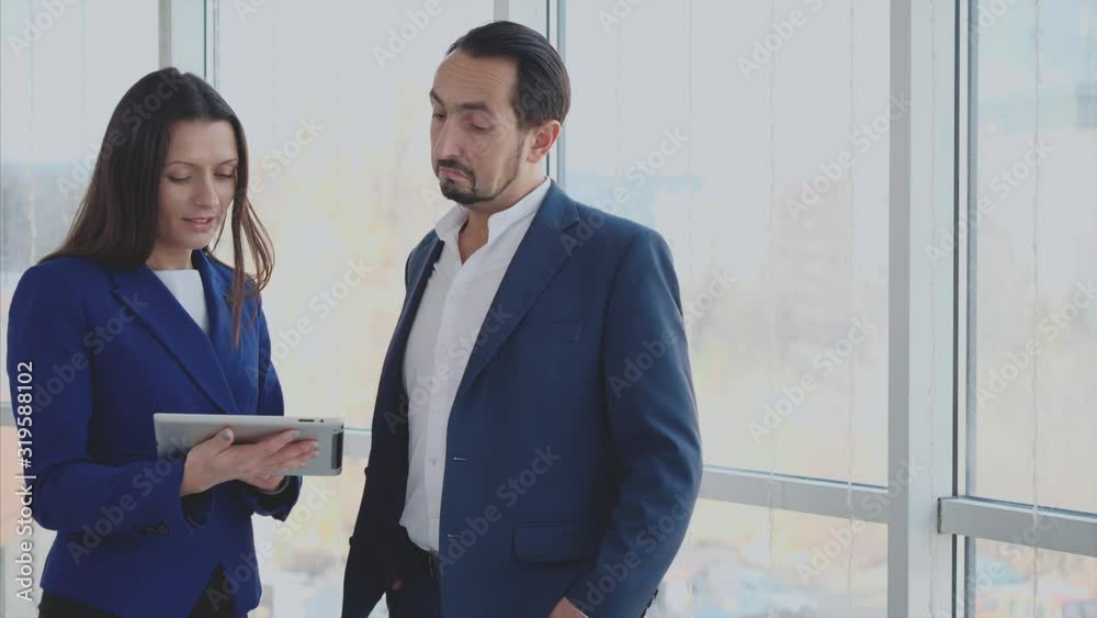 Close up. Business workers are discussing issues. Copy space. Woman is noting important information. Successful agreement. Blurred background. 4K. Close up. Business workers are discussing issues. Copy space. Woman is noting important information. Successful agreement. Blurred background. 4K.