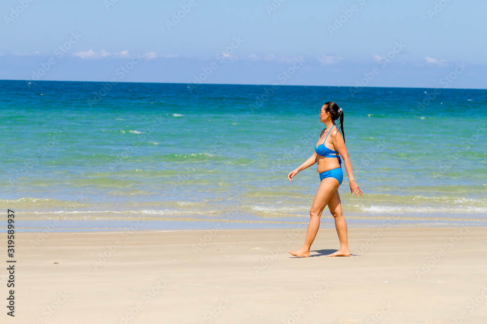 Woman relax with bikini blue on beach at Ban Krut