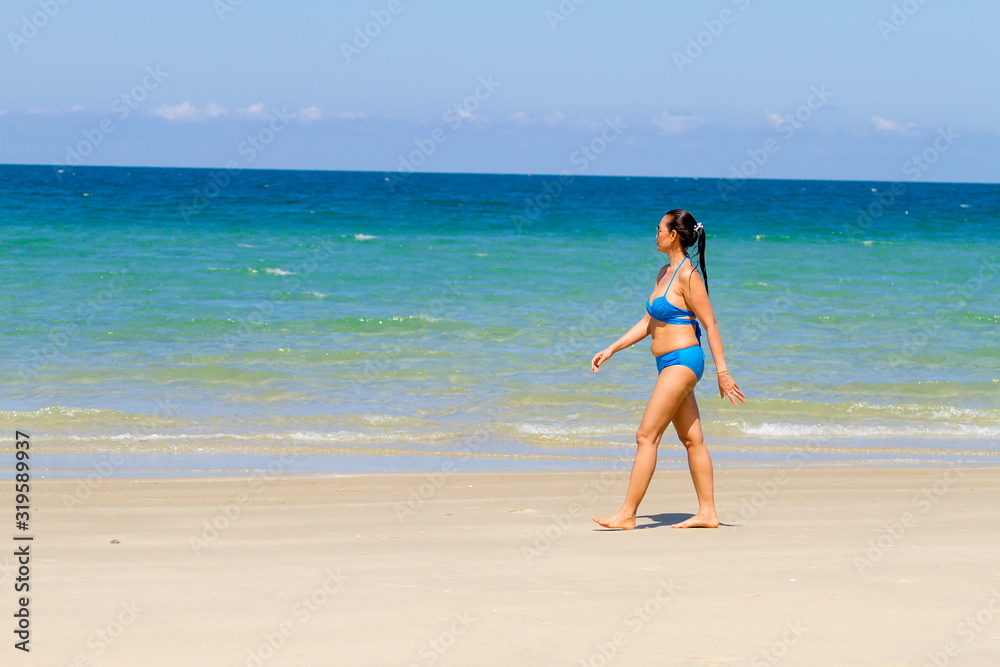 Woman relax with bikini blue on beach at Ban Krut Woman relax with bikini blue on beach at Ban Krut