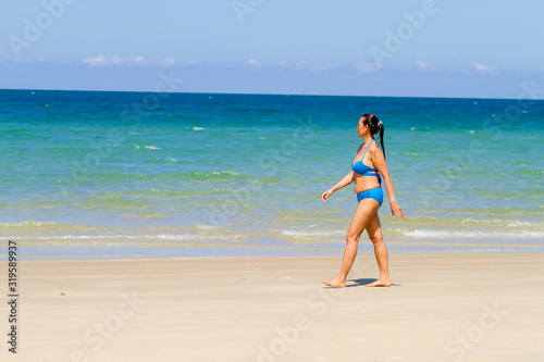 Woman relax with bikini blue on beach at Ban Krut