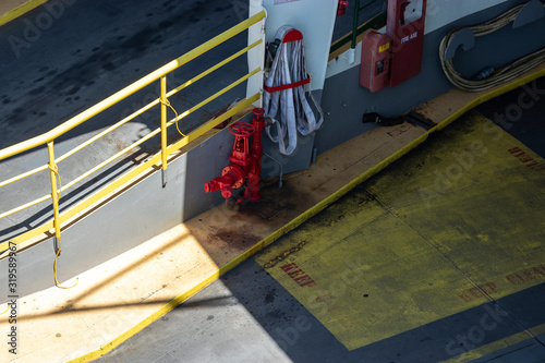 fire safety equipment mounted on the edge of a ferry boat