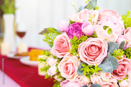 Valentine s day concept bouquet of red and pink roses Put on the table food lunch In a restaurant background