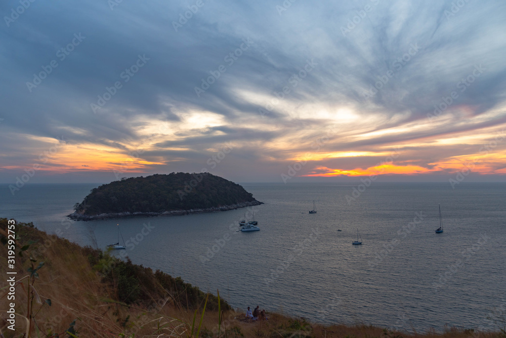 stunning sunset above Man island in front of Promthep cape and wind ...