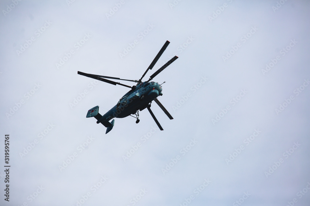 Russian military helicopter during flight in the air, a squadron formation of helicopters Russian military helicopter during flight in the air, a squadron formation of helicopters