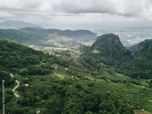 Aerial view of beautiful landscape of Doi Pha Hi an intricate mountain range in Mae Sai district of Chiang Rai province of Thailand in rainy season.