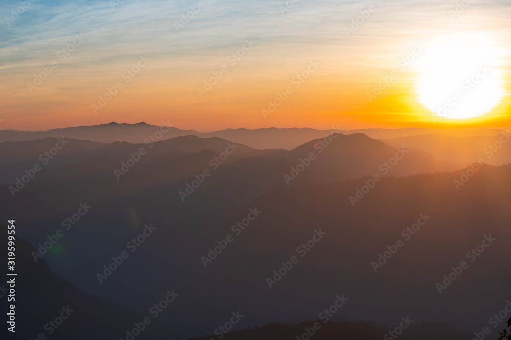 Mountain complex with misty or smoke pollution from wildfire during morning sunrise at the northern region of Thailand. Mountain complex with misty or smoke pollution from wildfire during morning sunrise at the northern region of Thailand.