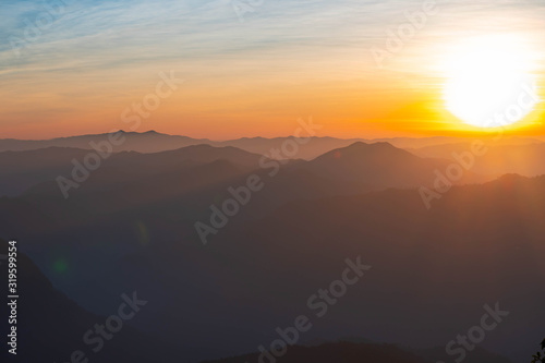 Mountain complex with misty or smoke pollution from wildfire during morning sunrise at the northern region of Thailand.