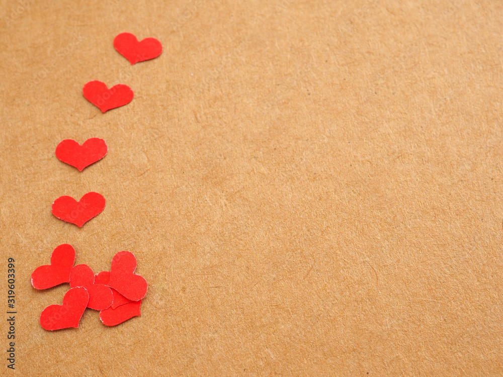 Fototapeta premium Many red heart on kraft paper background for Valentine's day..