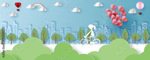White silhouette of girl ride a bike with hearts's balloon on landscape city view and blue  background. Valentine greeting card in paper cut style and vector design.
