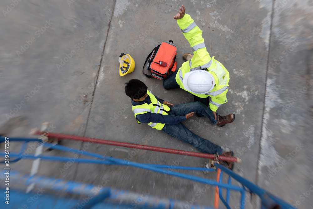 Fototapeta premium Accident at work of Maintenance worker on steel walkway in factory. Add zoom filter effect for feelings.