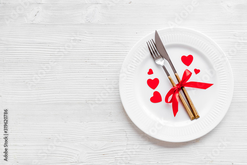 Valentines day table. Plate on white background top-down copy space