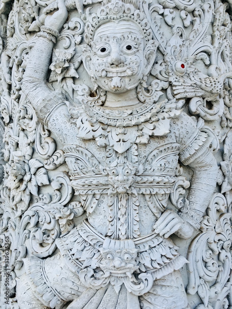 Beautiful finely of Ancient giant statue, traditional Thai style decorative in temple 