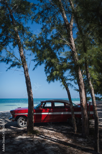 Old cars on a beach in Cuba.  © Rosemary