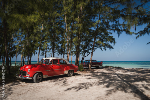 Old cars on a beach in Cuba.  © Rosemary