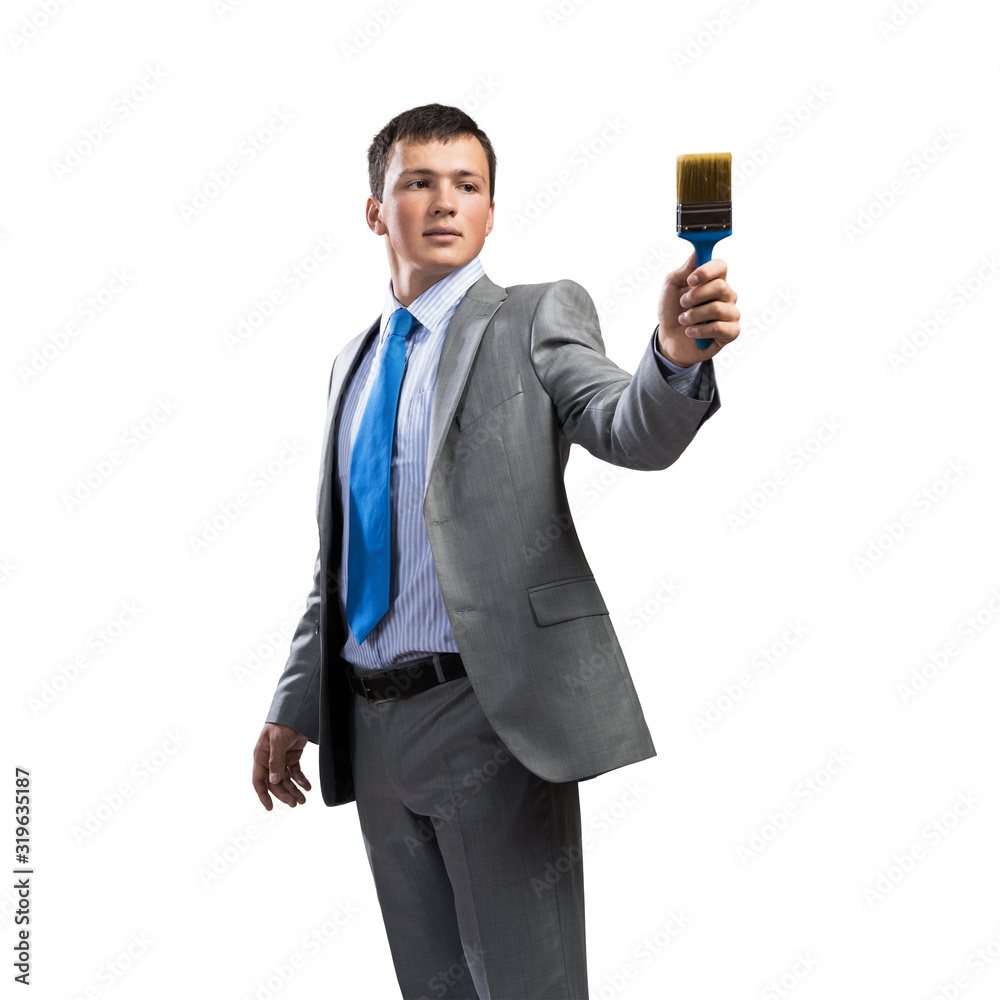 Creative businessman painter holding paintbrush Creative businessman painter holding paintbrush