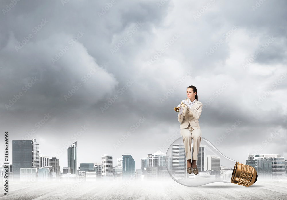 Attractive woman playing trumpet brass Attractive woman playing trumpet brass