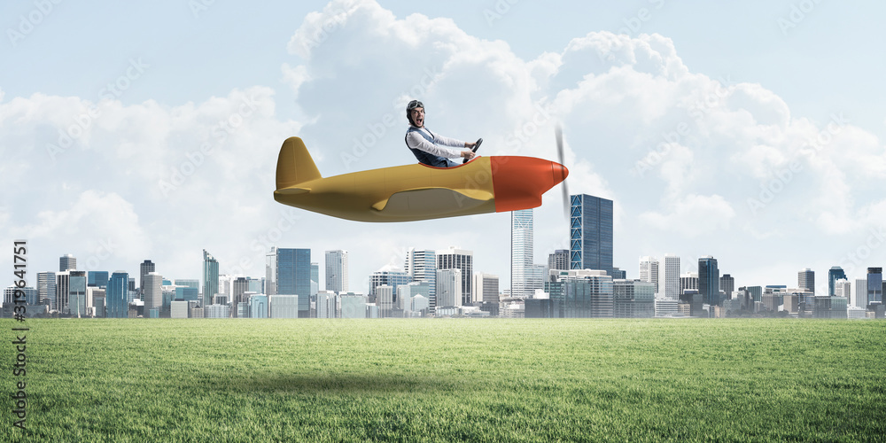 Businessman in aviator hat and goggles