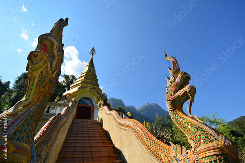 View of dragons at the entrance of the Wat Tham Pha Plong Temple in a sunny day with blue sky. Chiang Dao, Chiang Mai Province, Thailand. 