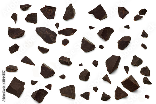 Broken, cracked or crushed dark chocolate parts from top view isolated on white background	