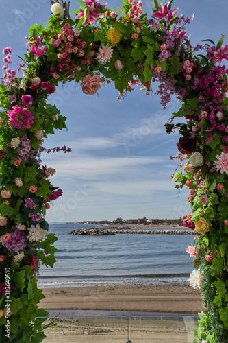 Arc flower at the beach in a sunny day with blue sky © Antonio