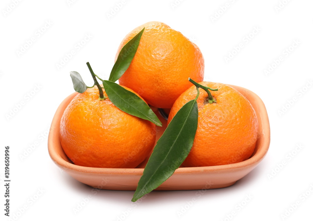 Mandarins with leaves in clay bowl isolated on white background Mandarins with leaves in clay bowl isolated on white background