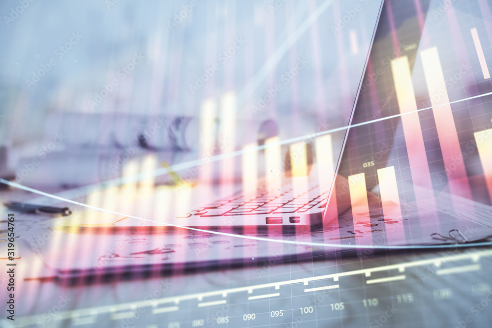 Forex Chart hologram on table with computer background. Multi exposure. Concept of financial markets.