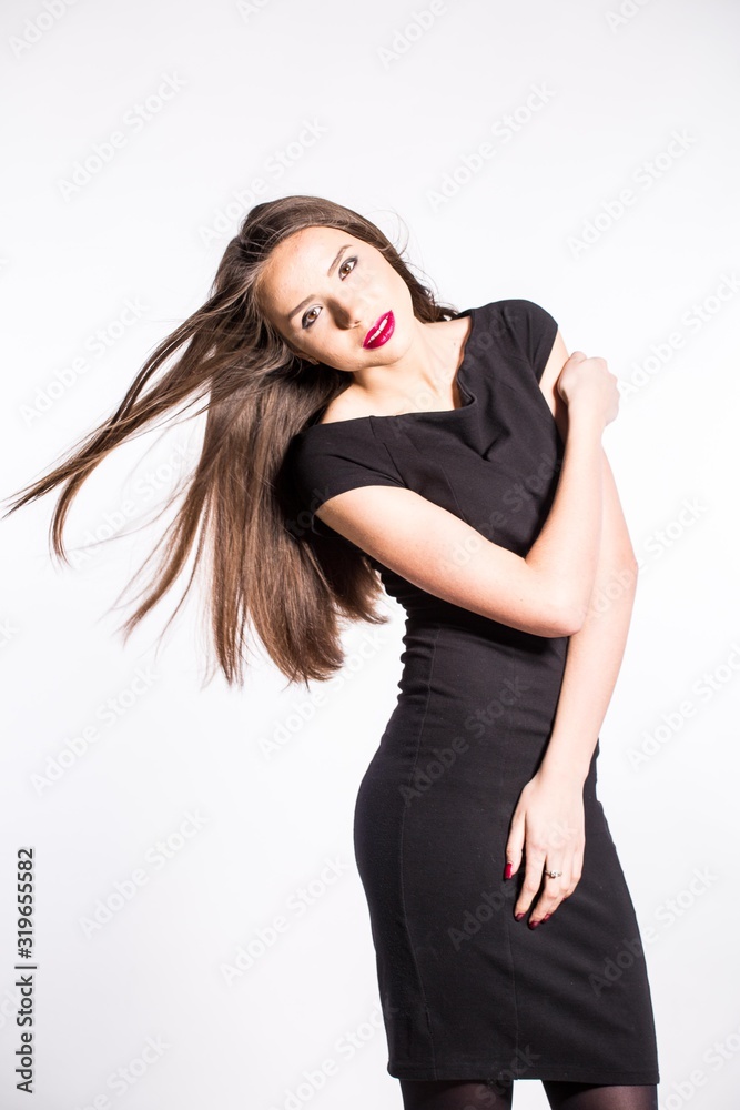 Beautiful young African American woman in black dress isolated over white background Beautiful young African American woman in black dress isolated over white background