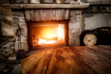 Desk of free space and blurred background of fireplace 