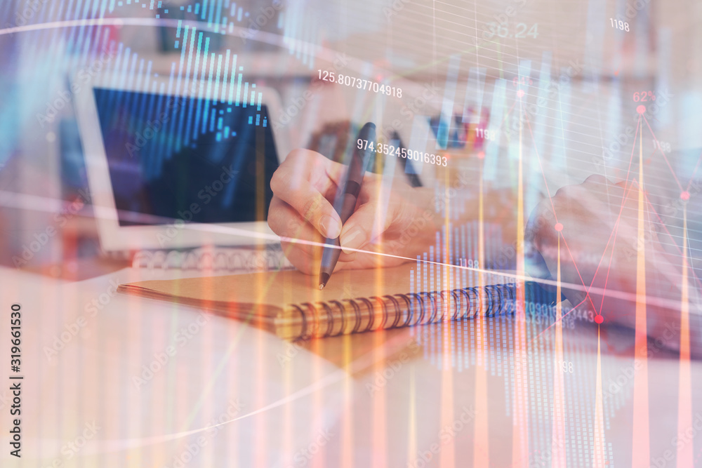 Financial graph displayed on woman's hand taking notes background. Concept of research. Double exposure Financial graph displayed on woman's hand taking notes background. Concept of research. Double exposure