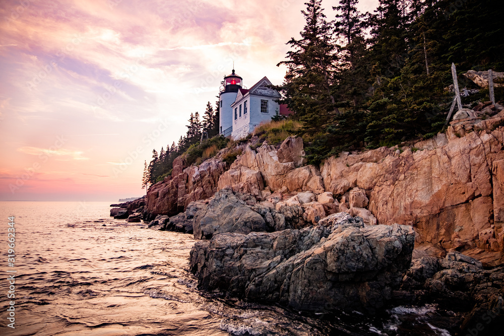 Sunset at Bass Harbor Lighthouse, a famous landmark on Mount Desert Island (ME, USA). It`s a popular spot for its breathtaking sunsets and colourful coastline. Sunset at Bass Harbor Lighthouse, a famous landmark on Mount Desert Island (ME, USA). It`s a popular spot for its breathtaking sunsets and colourful coastline.