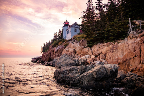 Sunset at Bass Harbor Lighthouse, a famous landmark on Mount Desert Island (ME, USA). It`s a popular spot for its breathtaking sunsets and colourful coastline.