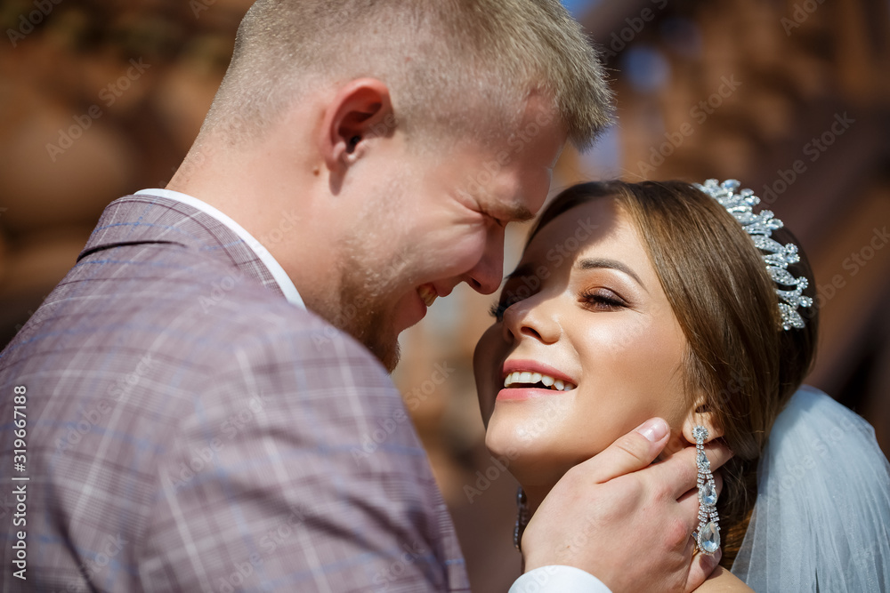 Bride and groom passionately hug on wedding day. Bride and groom passionately hug on wedding day.